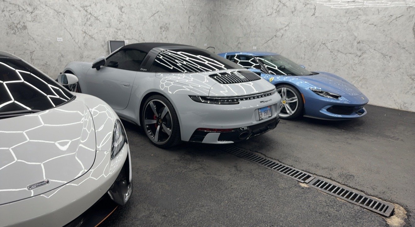 Porsche 911 Targa, Ferrari, and McLaren detailed and waiting in the Live Lavish showroom